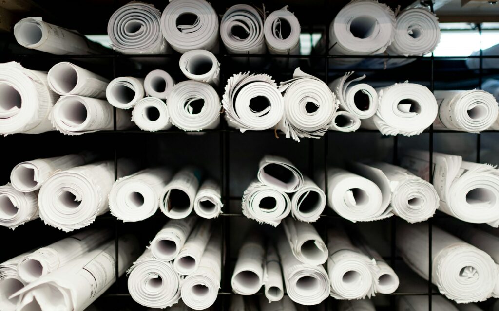 A rack full of rolls of white toilet paper